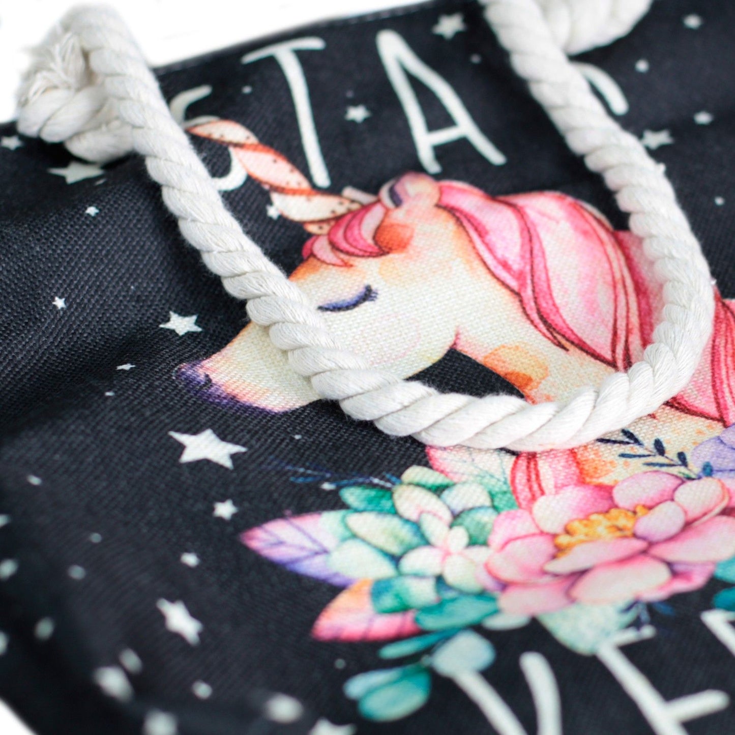 Woven style canvas beach tote bag featuring a mystical Star Keeper Unicorn design in vintage black and beige tones.
