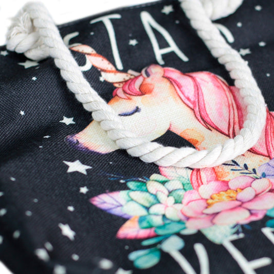 Woven style canvas beach tote bag featuring a mystical Star Keeper Unicorn design in vintage black and beige tones.