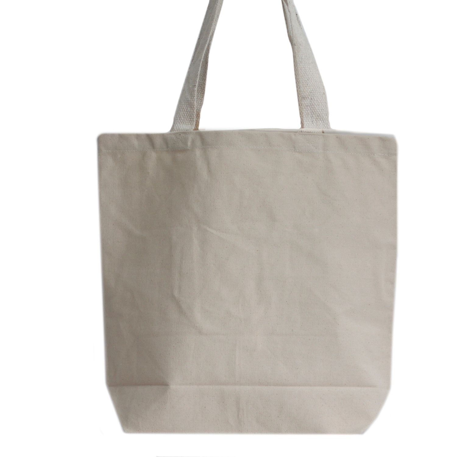 Large rectangular plain eco-friendly cotton tote bag with long shoulder handles shown in a neutral minimalist setting.