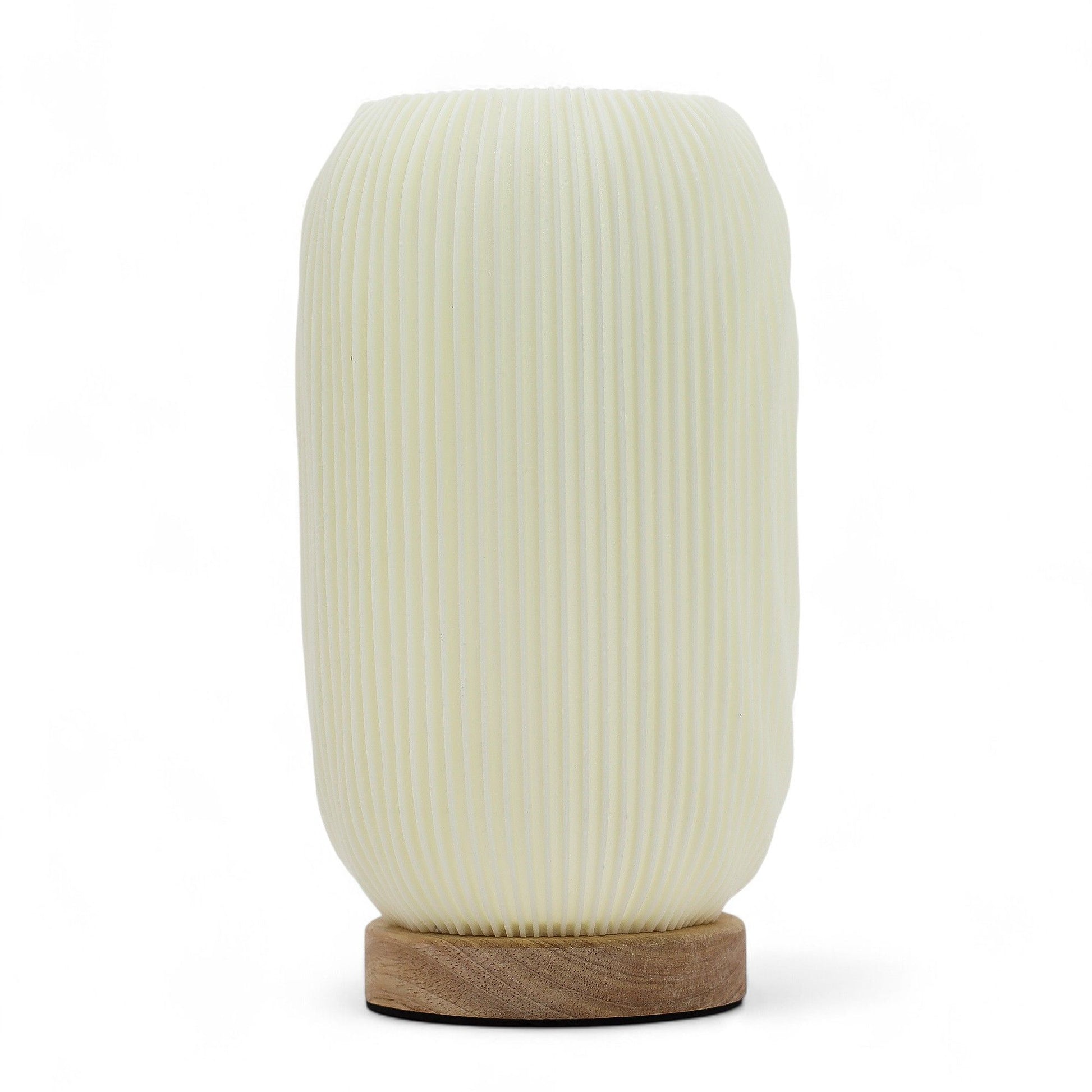 Sleek modern lamp with a vertical ribbed twisted design and minimalist white finish.