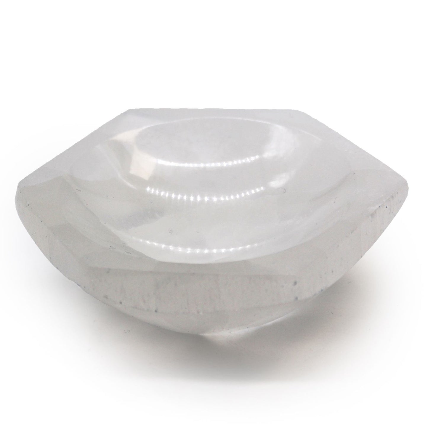 White translucent selenite bowl in a geometric hexagon shape with a smooth polished finish.