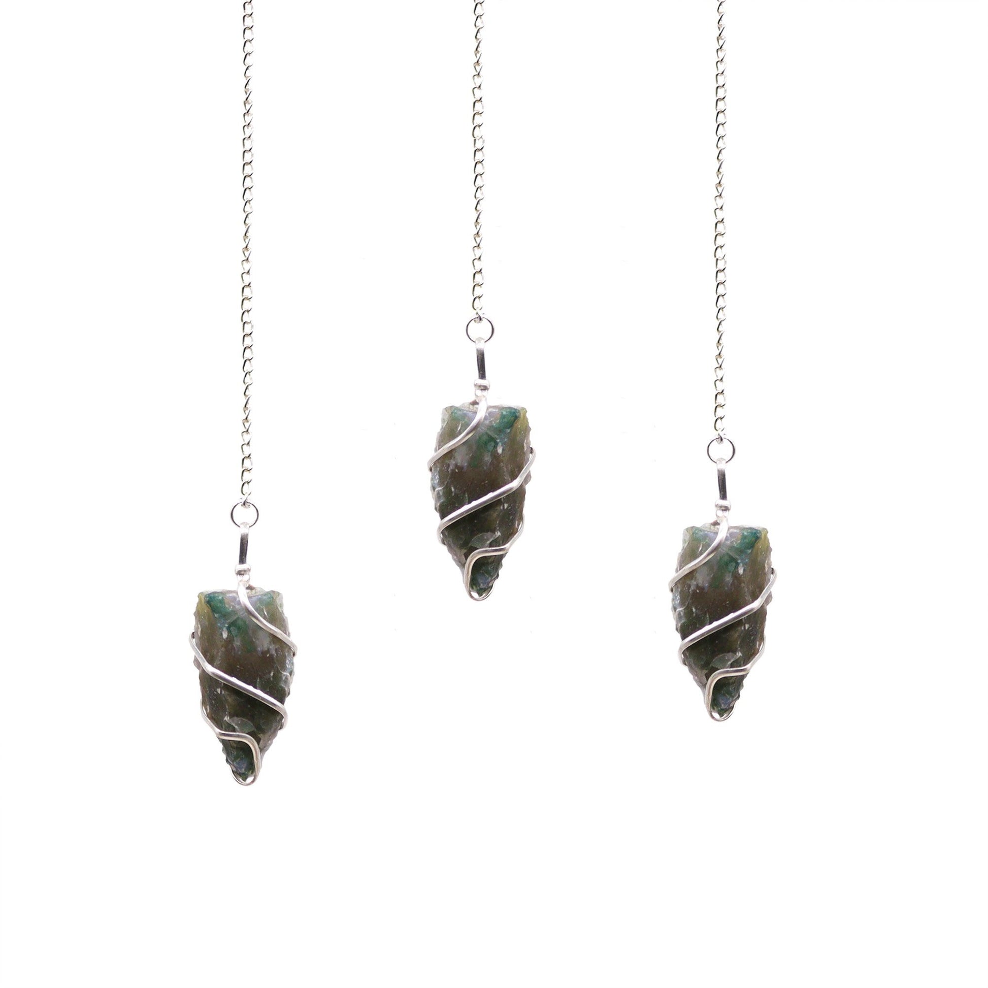 Natural unpolished moss agate crystal pendulum with green dendritic inclusions on a silver-coloured chain.