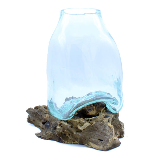 Large hand-blown molten glass vase draped over a natural rustic gamal wood root base.