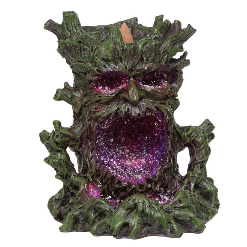 Intricate Green Man backflow incense burner with a crystal-style base and glowing LED lights.