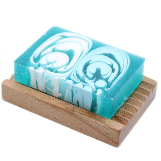 A 100g slice of handcrafted soap with a clean white and light blue marble effect texture.