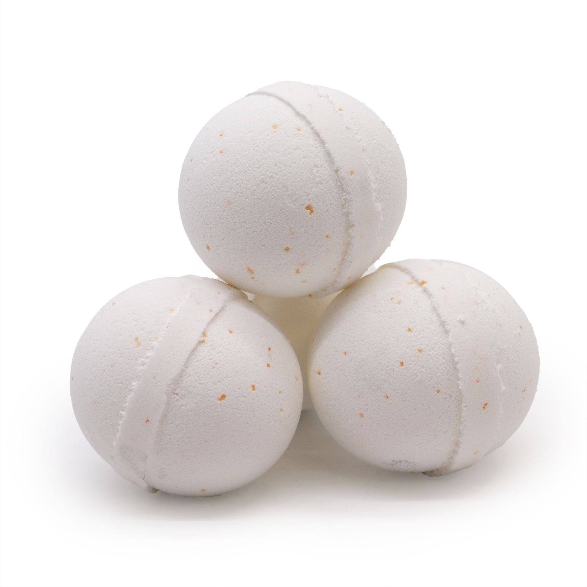 Large round effervescent bath bomb with a speckled texture, perfect for a detoxifying aromatherapy spa experience at home.