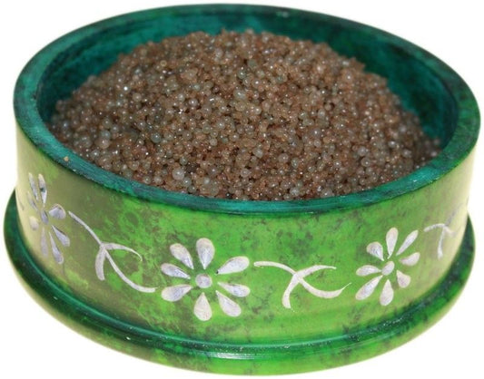 Close-up of aromatic sandalwood scented simmering granules for oil burners.