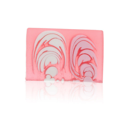A large 1.2kg handcrafted rose soap loaf with a textured pink surface and delicate floral fragrance.