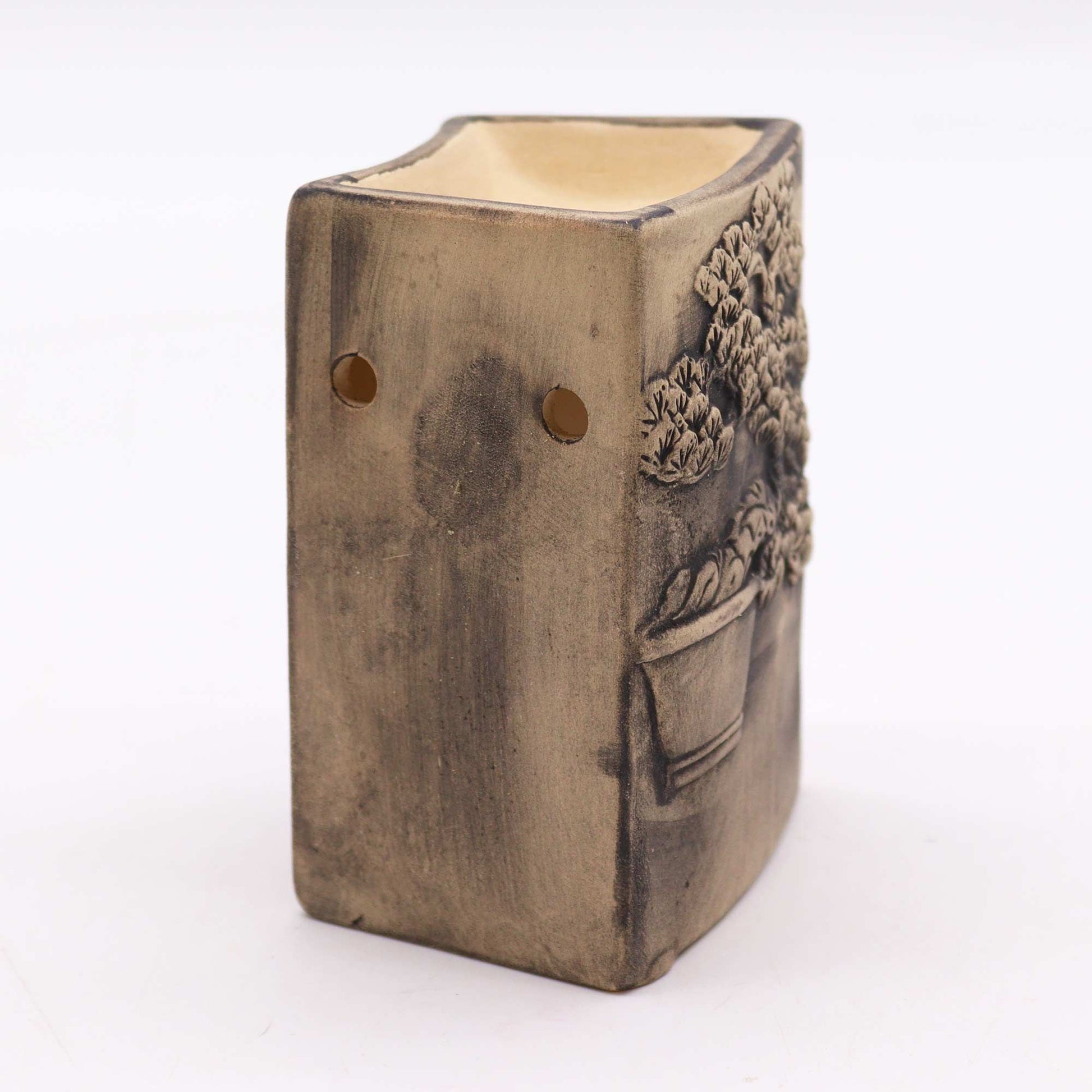 Hand-painted ceramic oil burner in slate grey featuring a delicate white bonsai tree design on a textured surface.