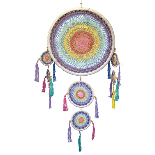 Large circular dreamcatcher featuring a vibrant pastel rainbow web, decorative beads, and flowing colourful feathers.