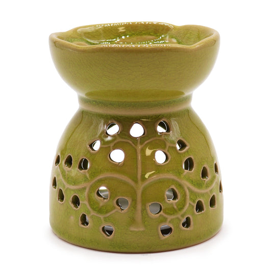 Vibrant lime green ceramic oil burner featuring a decorative cutout Tree of Life design and a glossy glazed finish.