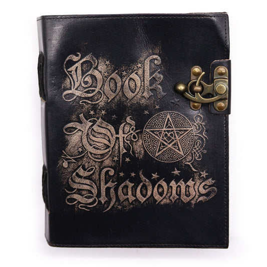Vintage leather-bound journal with textured deckle-edged pages and a mystical embossed cover design.