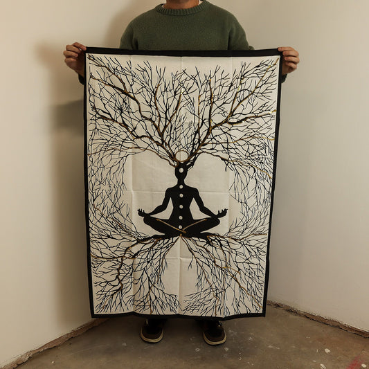 Detailed cotton wall hanging depicting a meditative figure with deep roots and golden highlights on a dark background.