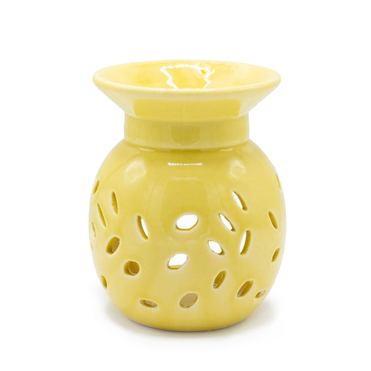Cheerful yellow ceramic oil burner featuring a delicate carved floral pattern and a glossy finish.