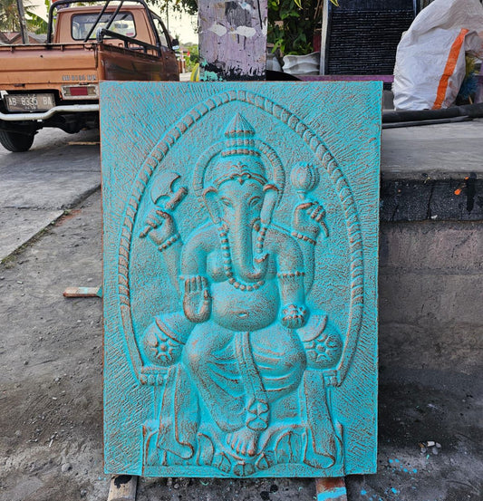 Large Ganpati turquoise relief wall art in a decorative iron frame.