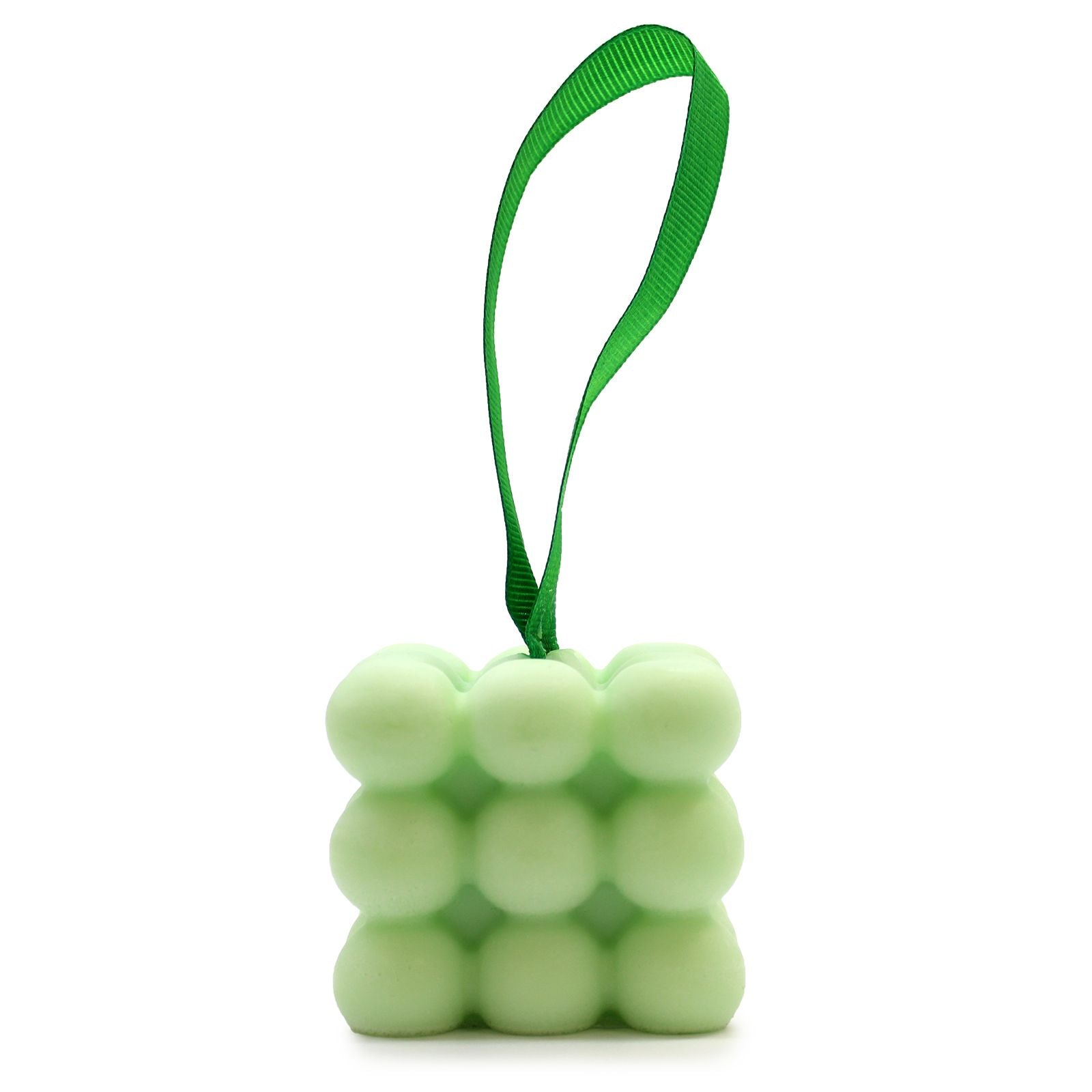 Nubbly textured green massage soap bar tied with a decorative ribbon in a gift box.