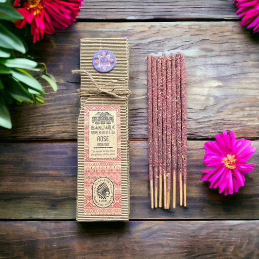 Handcrafted rose resin incense stick showing a thick natural resin coating for a long-lasting floral fragrance.