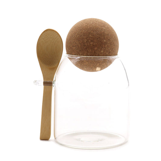 Clear 10cm glass jar with a round cork ball lid and a small wooden spoon attached to the side.