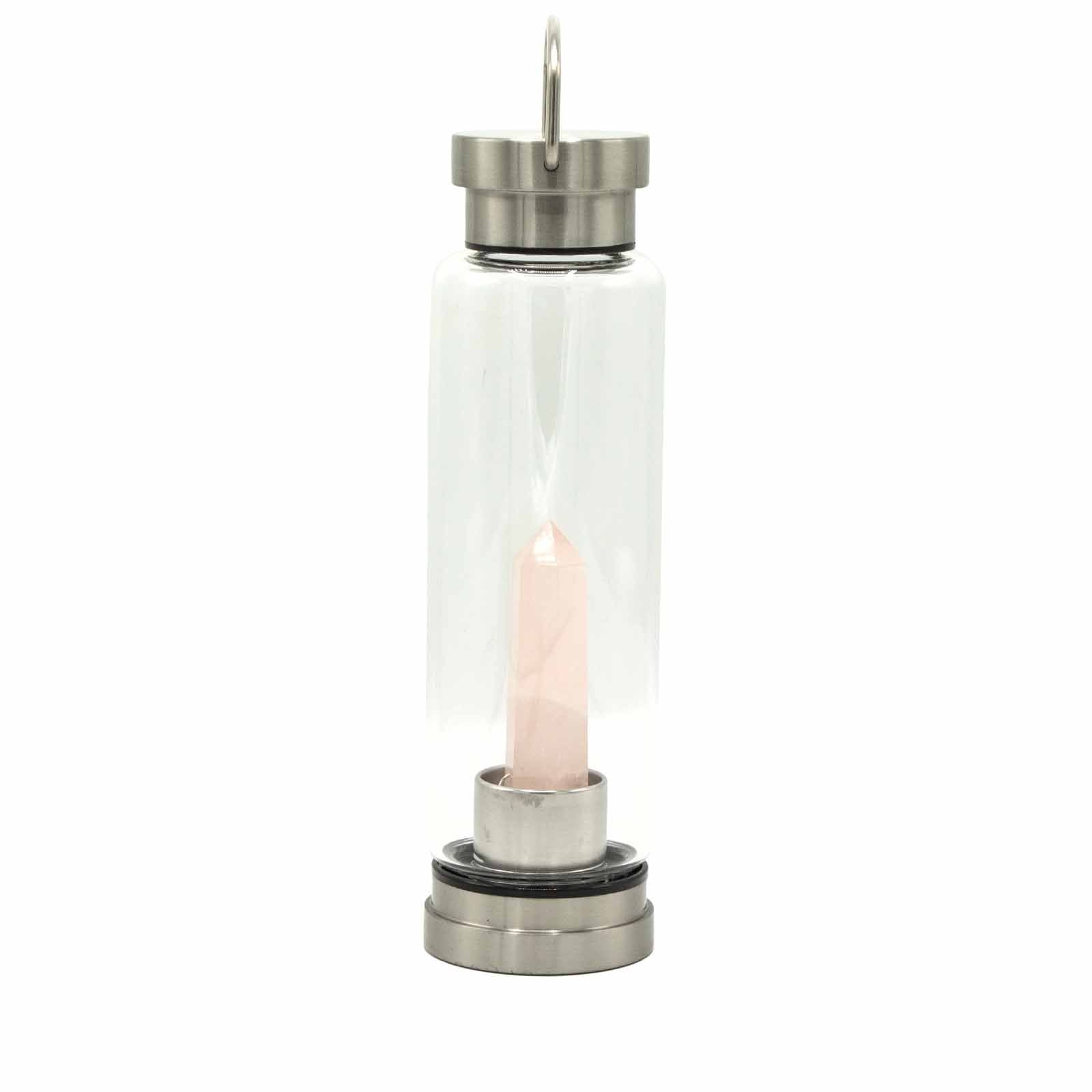 Eco-friendly glass water bottle featuring a natural rose quartz crystal obelisk inside on a stainless steel base.