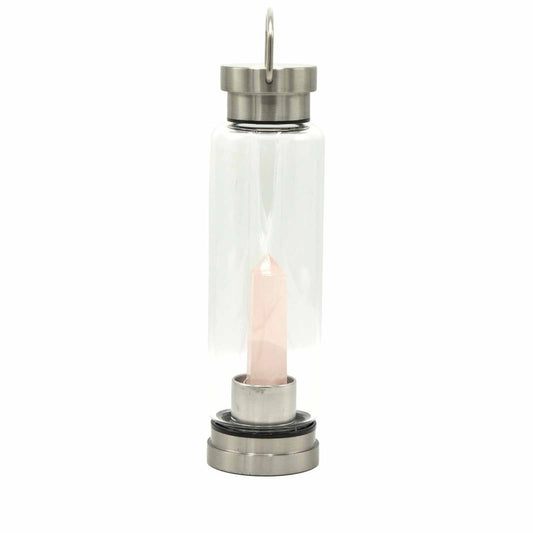Eco-friendly glass water bottle featuring a natural rose quartz crystal obelisk inside on a stainless steel base.