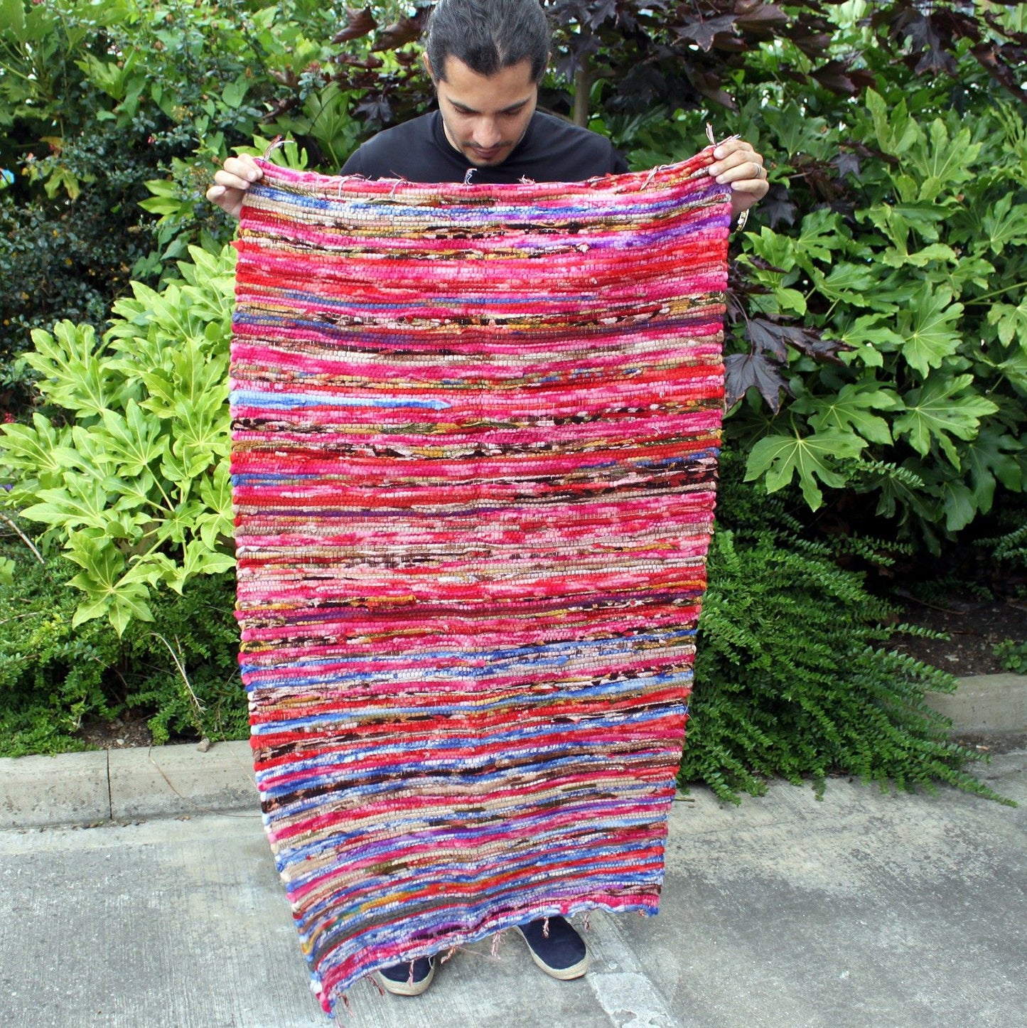 Handmade colourful velvet Indian rag rug with a textured woven pattern and soft cotton finish.