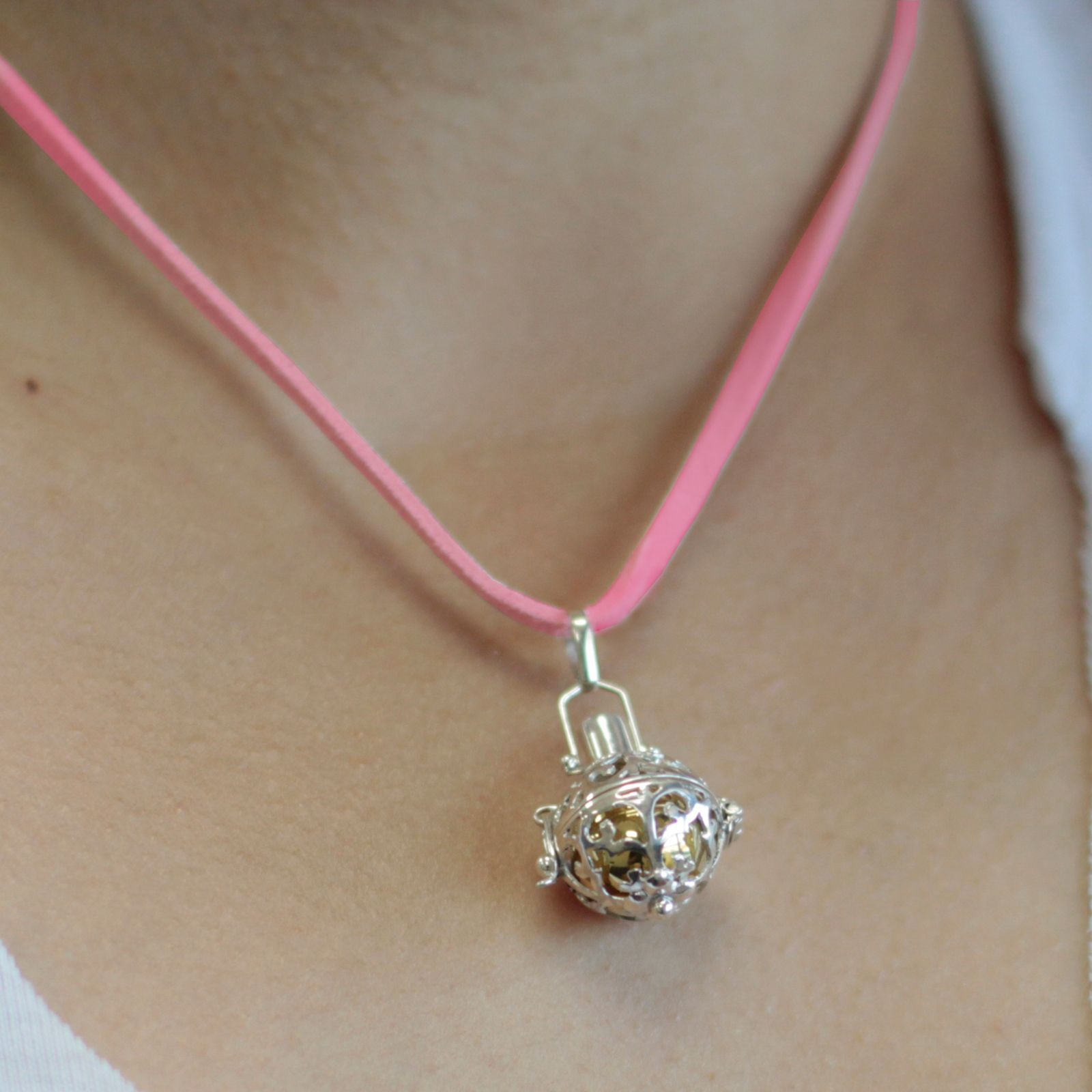 Intricate 925 sterling silver angel bell pendant with detailed metalwork and a small circular bale.
