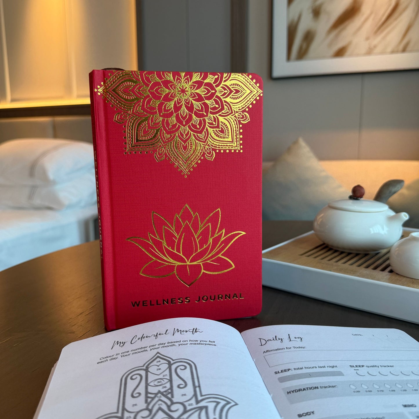 Striking red wellness journal featuring an intricate golden mandala and lotus flower design on the front cover.