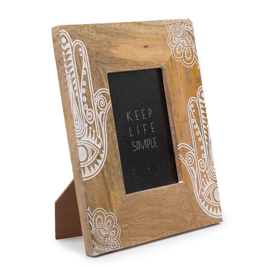 Medium hand-carved mango wood picture frame in a distressed white finish with intricate floral patterns.