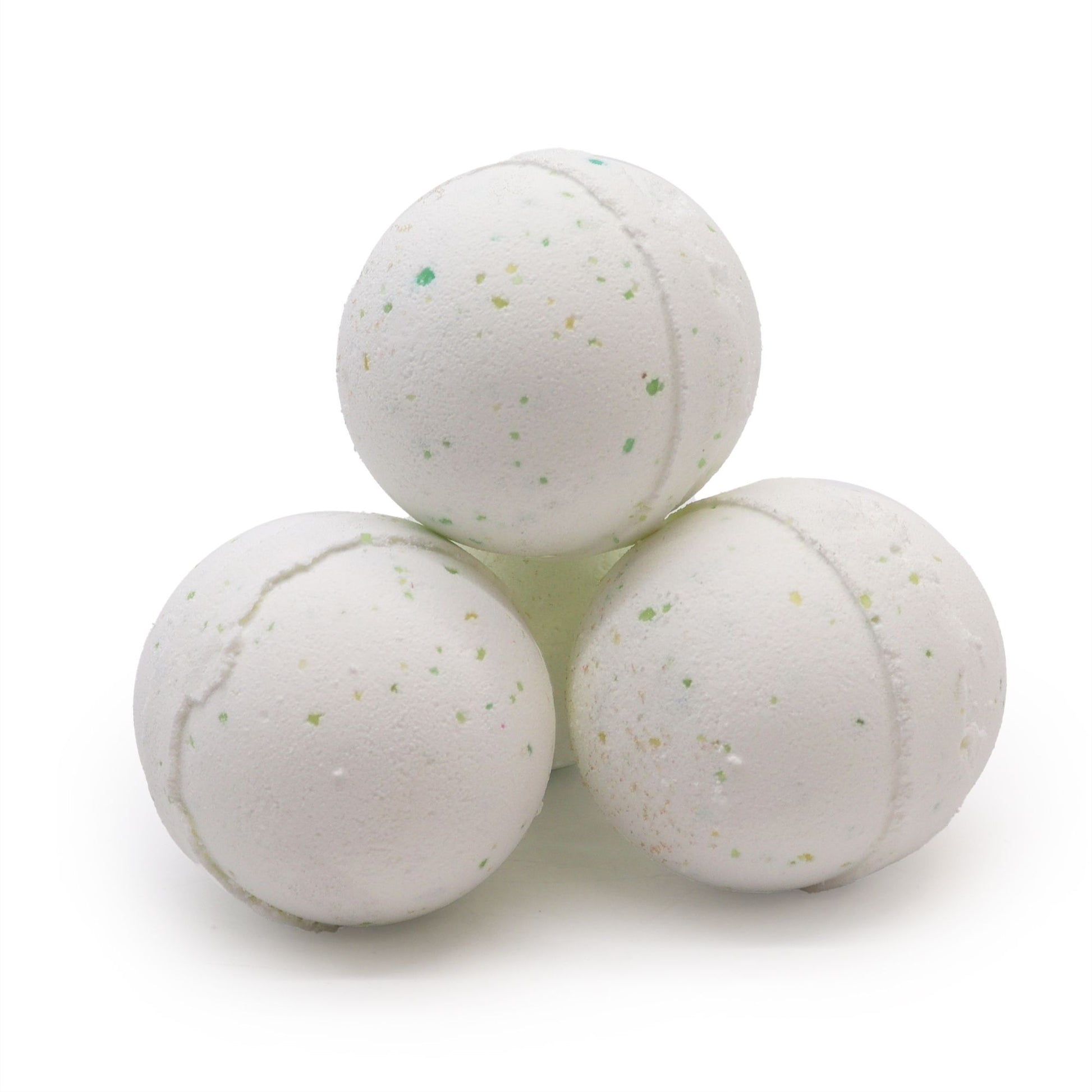 Large round artisanal bath bomb with a textured surface and botanical petal inclusions.