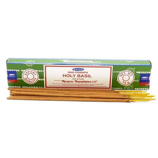 Hand-rolled incense sticks with a natural finish, releasing a delicate plume of aromatic smoke.