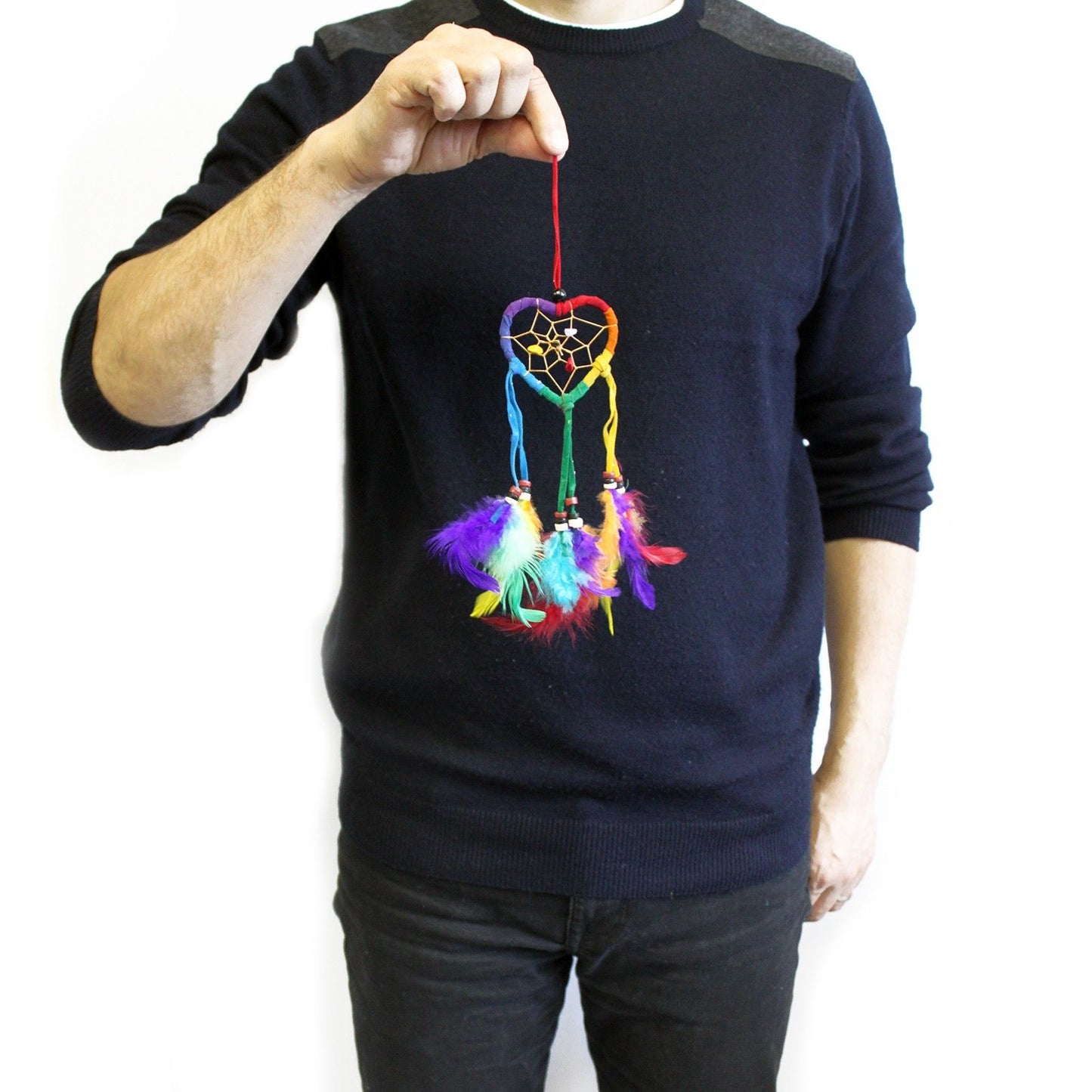 Small heart-shaped dreamcatcher with vibrant rainbow-coloured threads and hanging feathers.