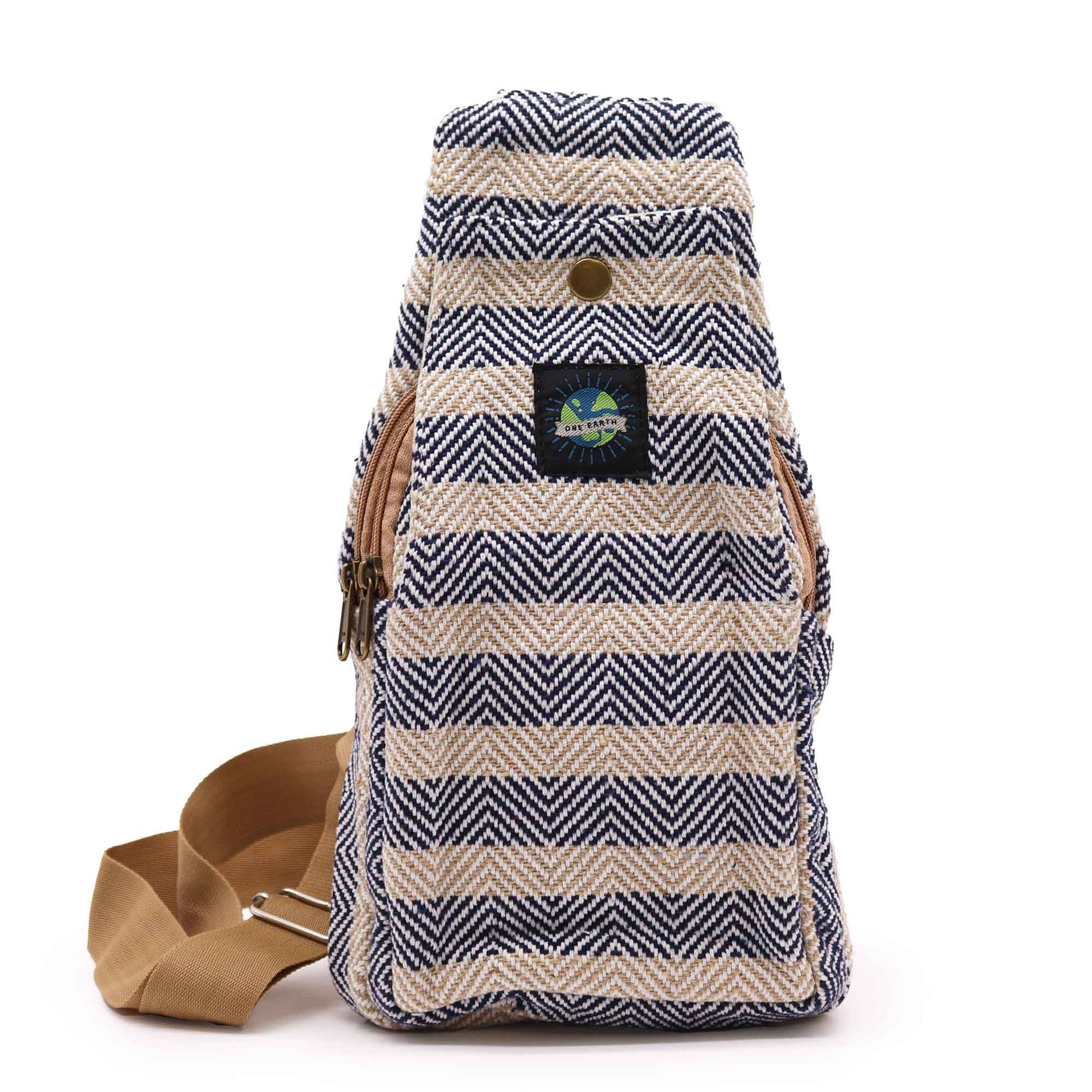 Timeless natural cotton cross-body bag featuring a sophisticated tan and navy blue colourway with a long shoulder strap.