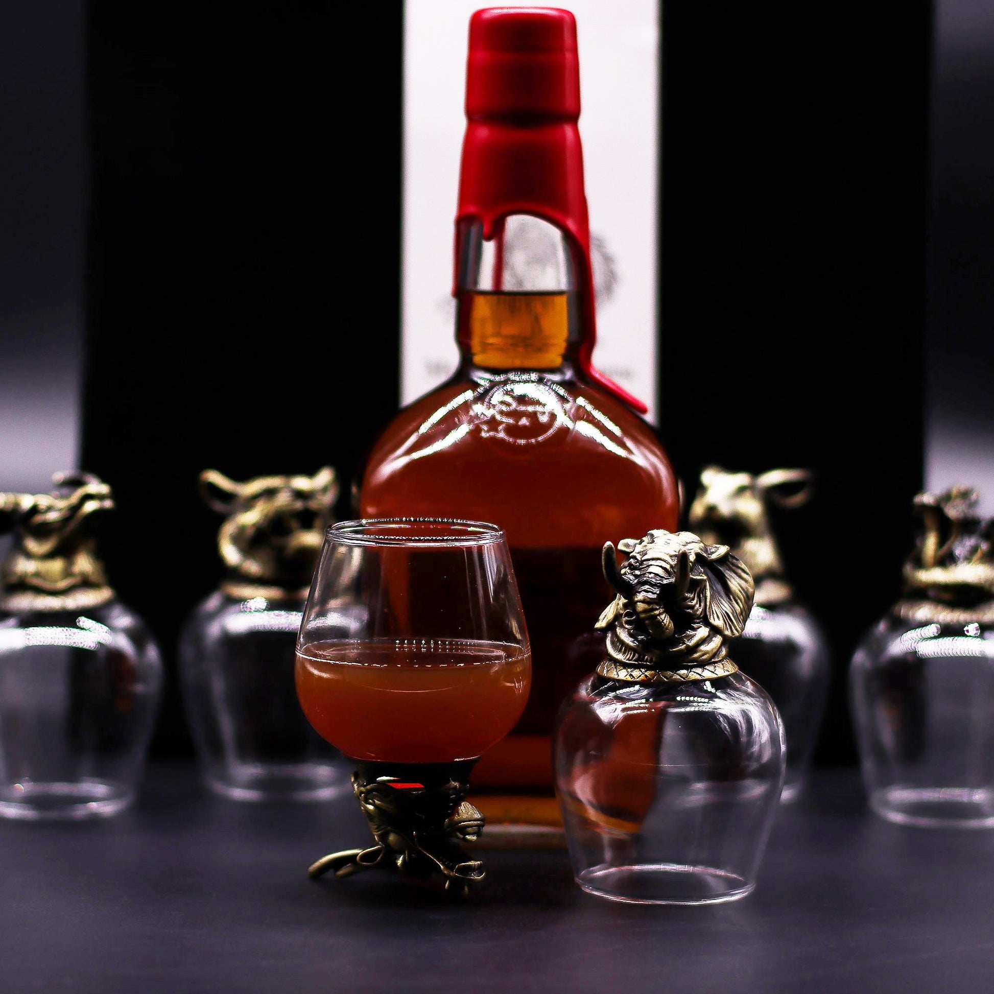Six elegant 100ml glasses with crystal clear bowls mounted on decorative antique bronze bases featuring mystical creatures.