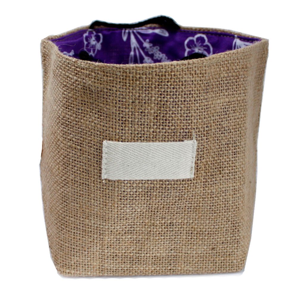 Large eco-friendly natural jute gift bag featuring a soft lavender cotton lining and sturdy handles.
