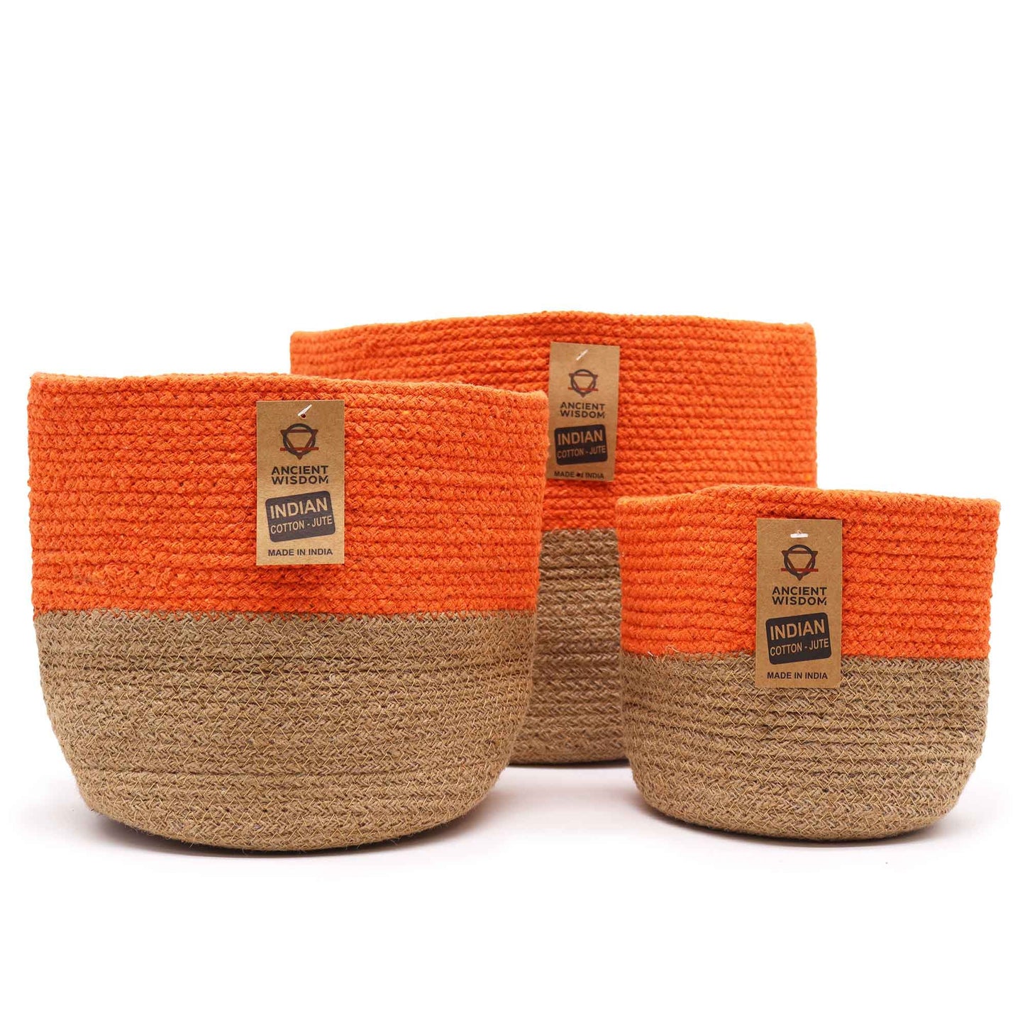 Set of three nesting round storage baskets made from woven orange cotton rope with integrated handles.