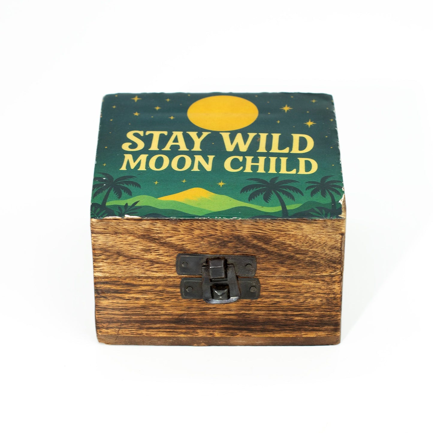 Small round wooden box with a blue enamelled lid featuring the silver text Stay Wild Moon Child and celestial stars.