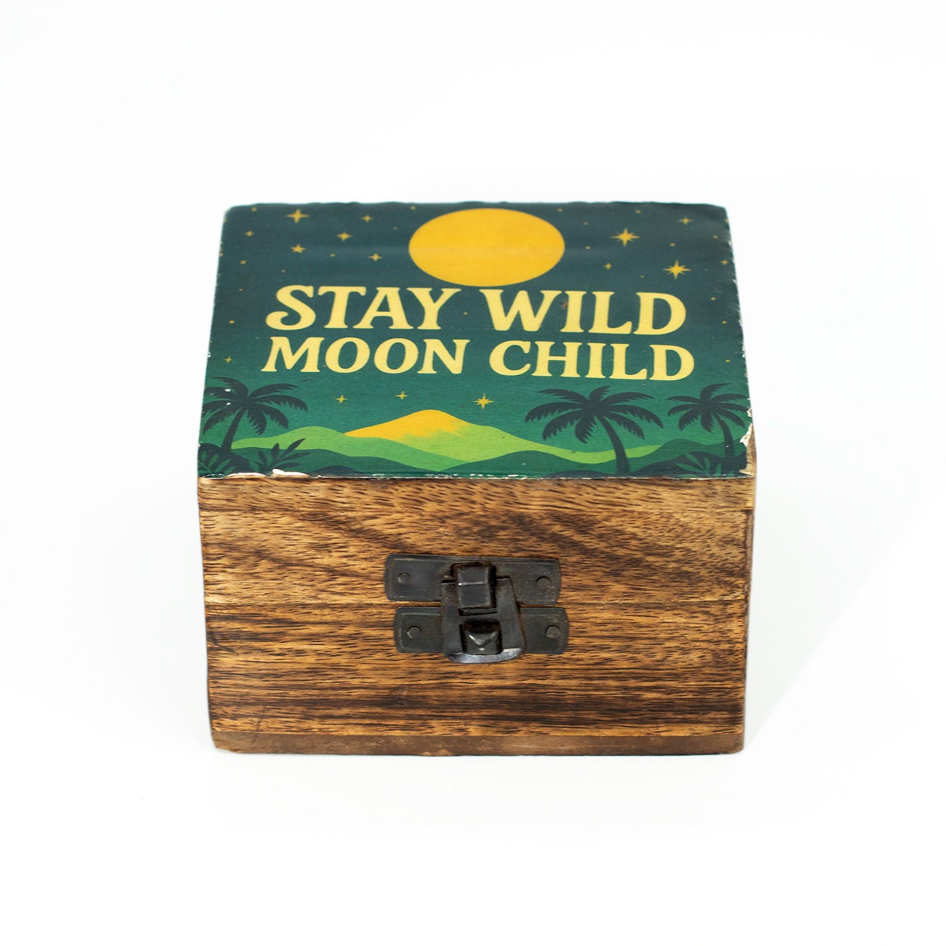 Small round wooden box with a blue enamelled lid featuring the silver text Stay Wild Moon Child and celestial stars.