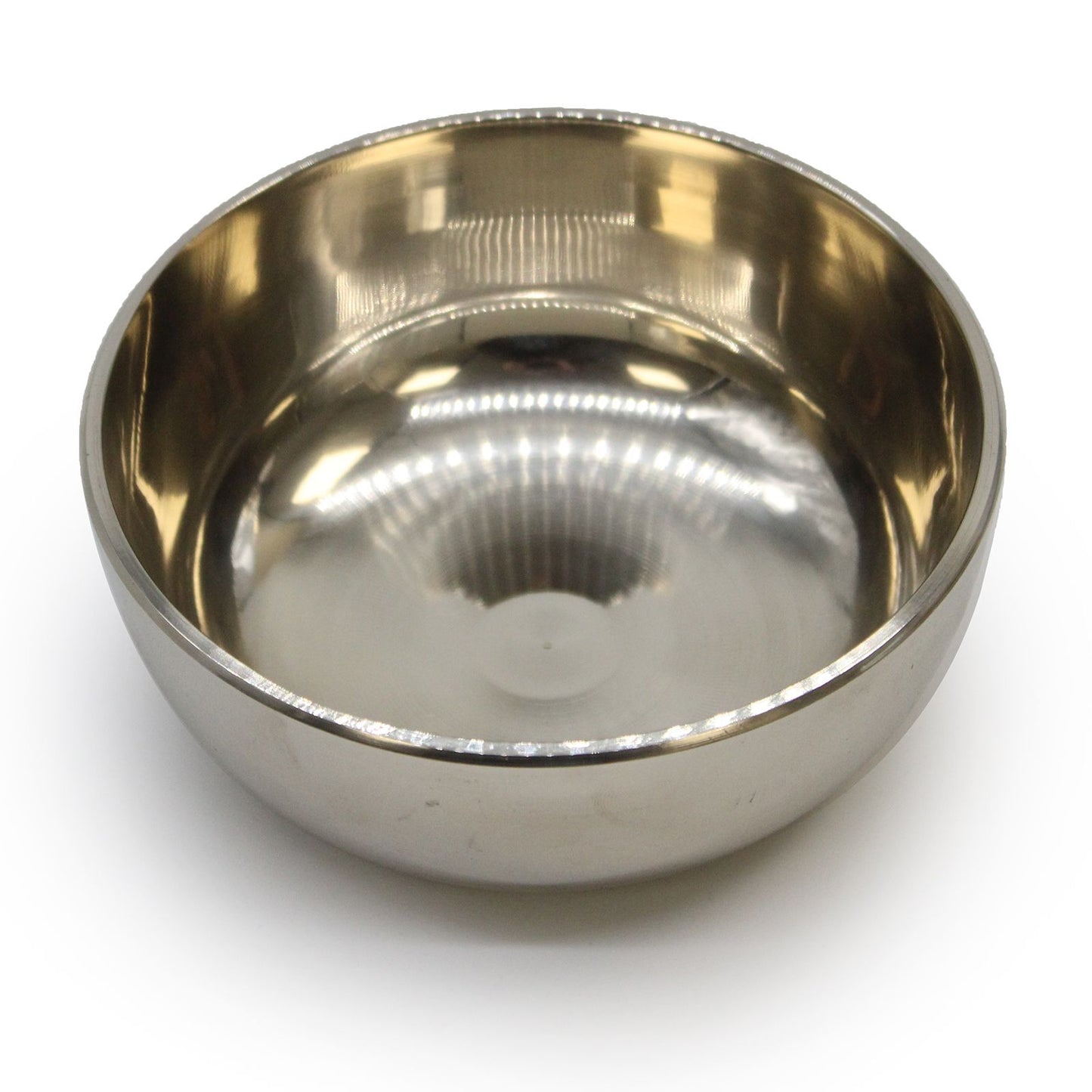 Handcrafted medium brass Tibetan singing bowl with a smooth metallic finish and decorative rim.