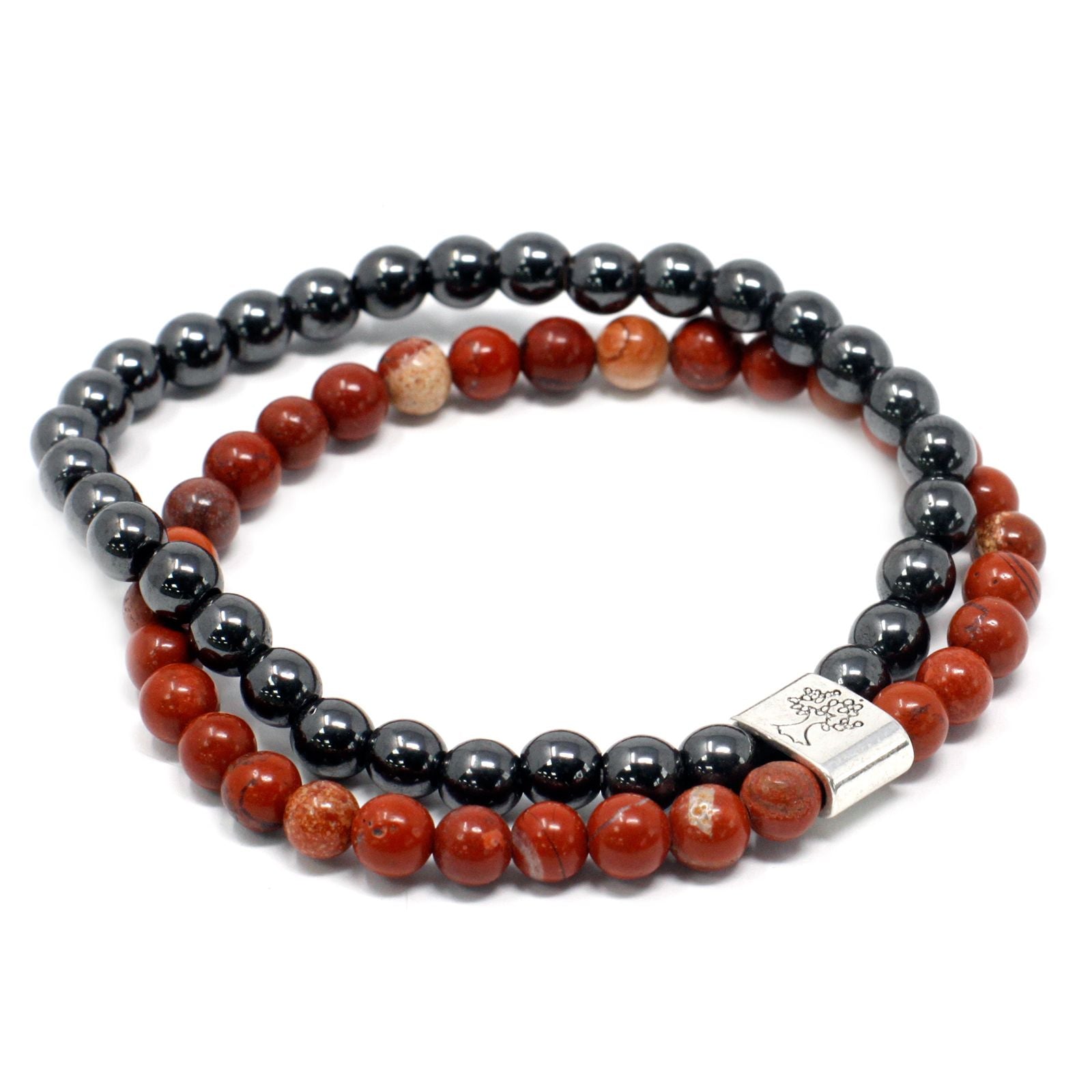Close-up of a deep red gemstone bead bracelet with magnetic properties on a stretchy band.