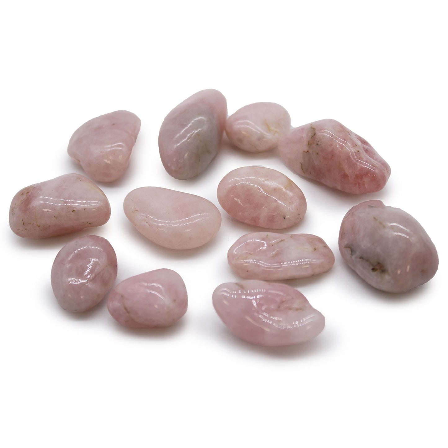 Several smooth, polished pale pink rose quartz tumble stones with a translucent finish.