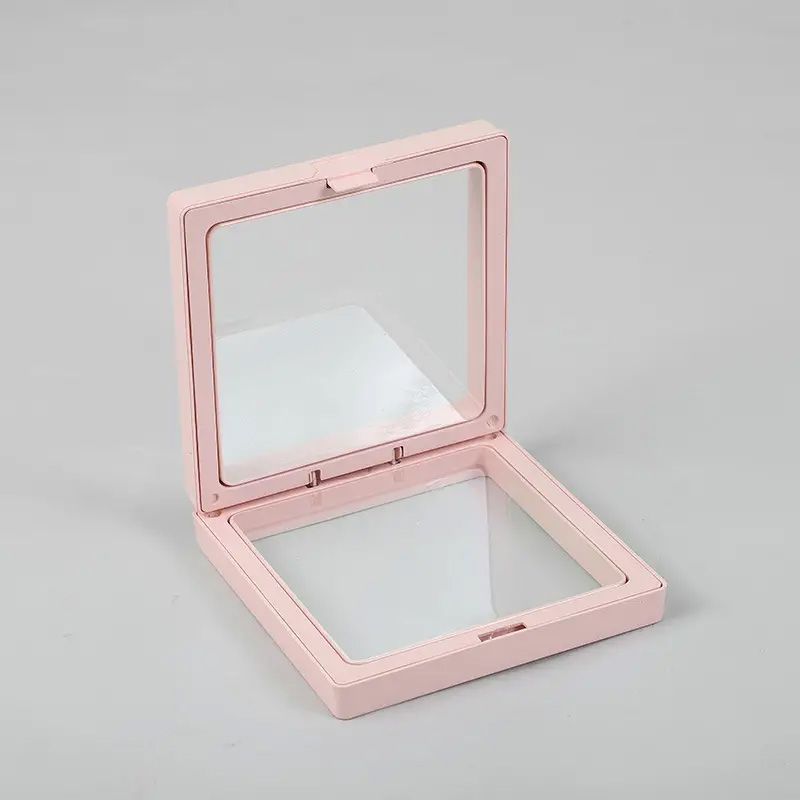 Small square pink 3D floating frame with a transparent flexible membrane for displaying small objects.