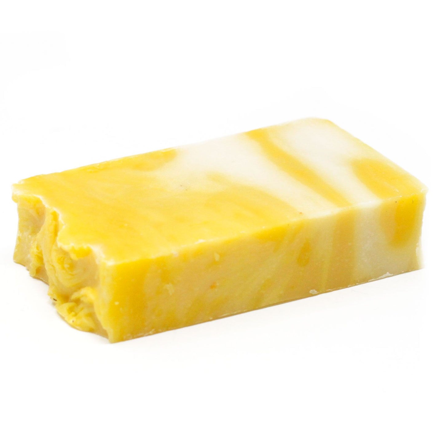 A textured slice of yellow artisan lemon olive oil soap with natural edges.