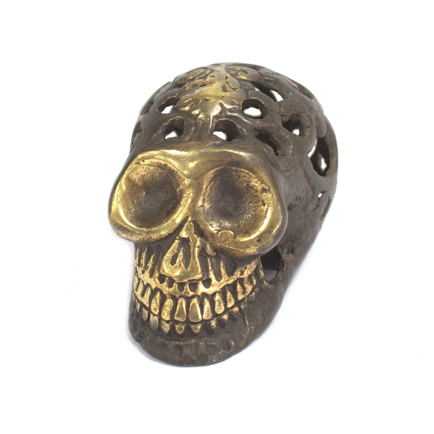 Small vintage-style brass skull with intricate detailing and an aged golden metallic finish.