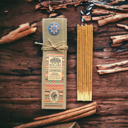 Handcrafted ritual resin incense stick with a textured cinnamon coating on a wooden core.