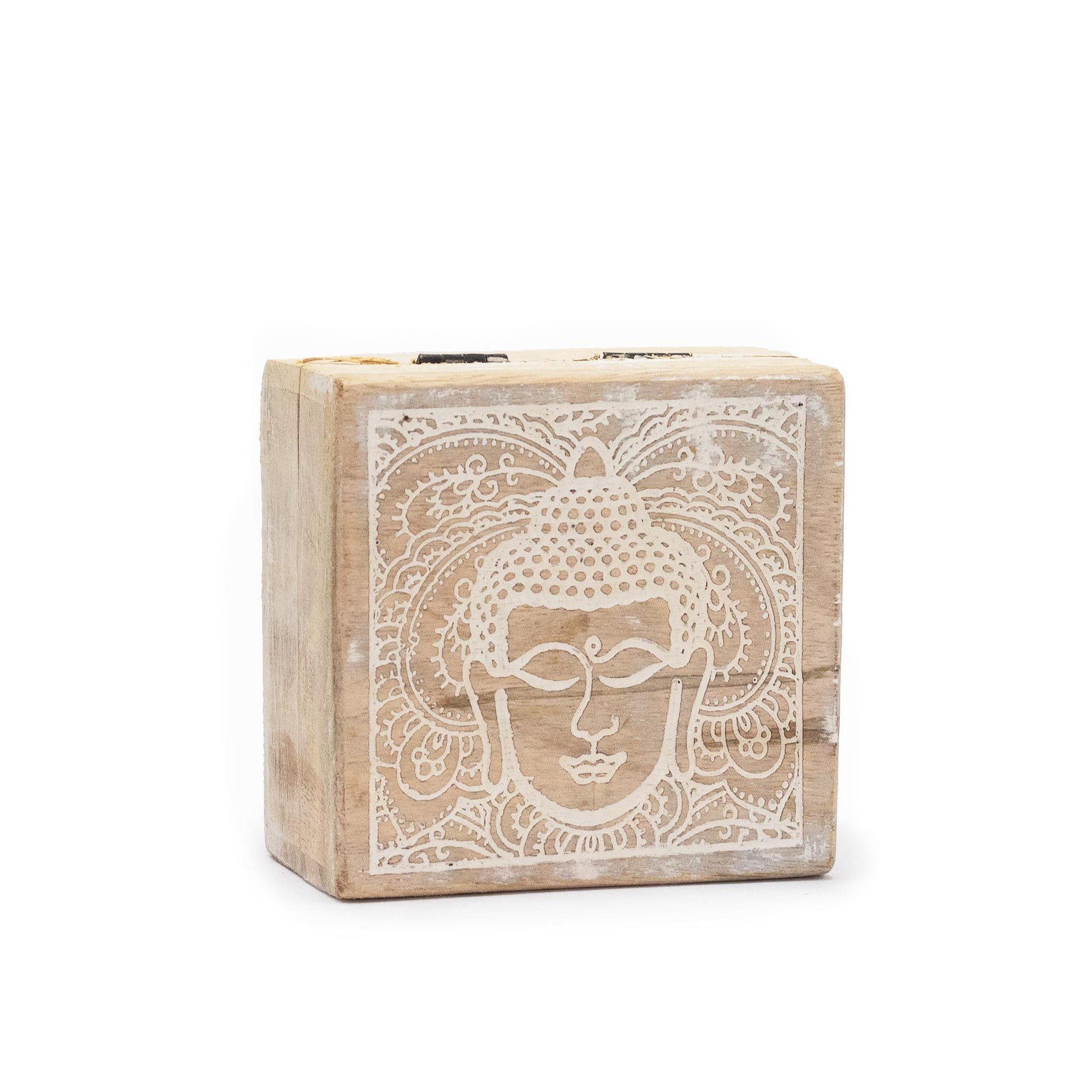 Small square wooden box with a hand-carved Buddha face design and a rustic whitewash finish.