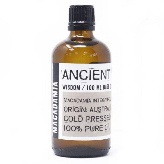 A clear glass bottle containing 100ml of golden macadamia base carrier oil for aromatherapy and skincare.