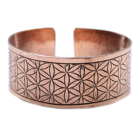 Adjustable copper Tibetan cuff bracelet engraved with the sacred geometry Flower of Life symbol.