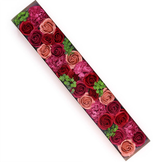 Elegant extra long gift box filled with realistic soap flowers in vintage rose shades of pink and cream.