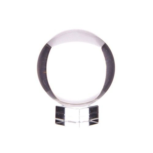 Small 30mm clear crystal ball resting on a minimalist stand, reflecting light with clarity.