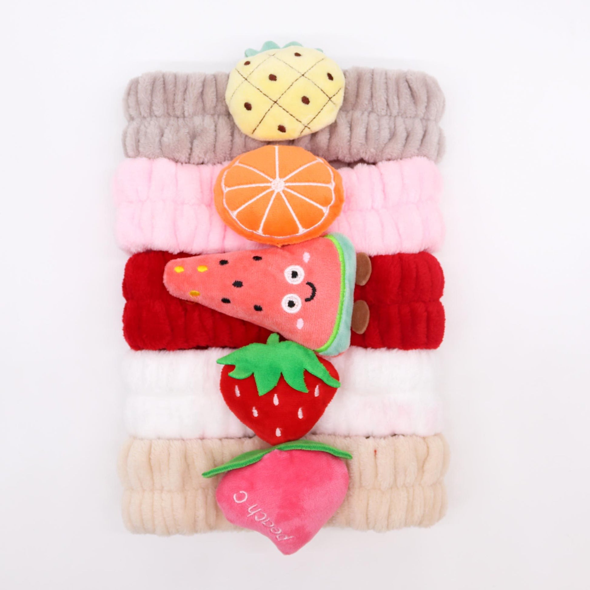 Set of five soft flannel makeup headbands featuring colourful assorted fruity patterns.